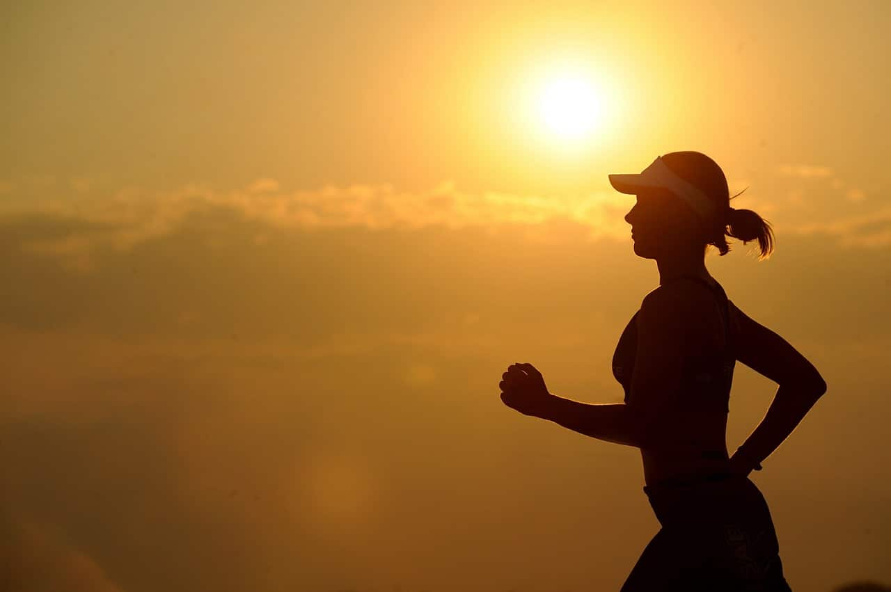 A woman running with the sun rising behind her. Cardiovascular fitness depends on testosterone in both men and women. Learn more.