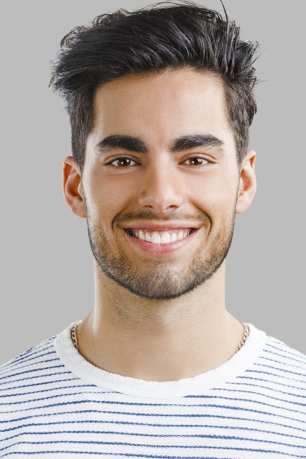 Handsome young man smiling stock photo