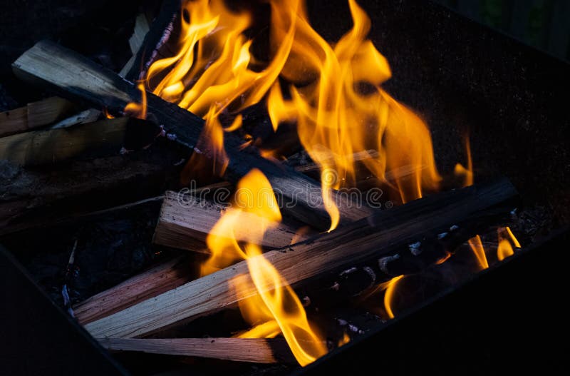 Logs burn in a bonfire close up royalty free stock image