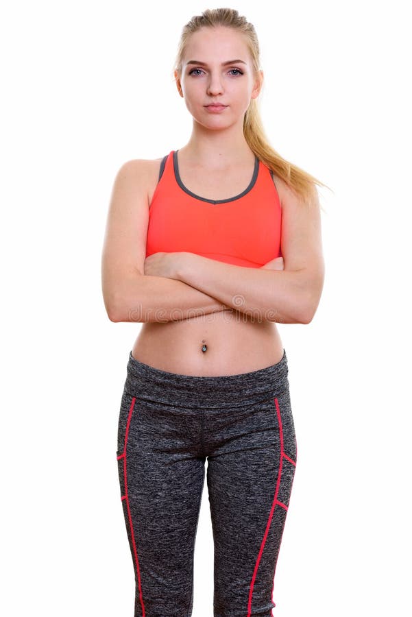 Studio shot of young beautiful teenage girl standing with arms c. Rossed ready for gym stock photo