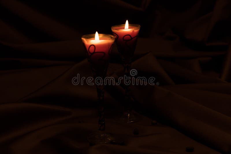 Two candles burn in the dark room. Mysterious situation royalty free stock photos