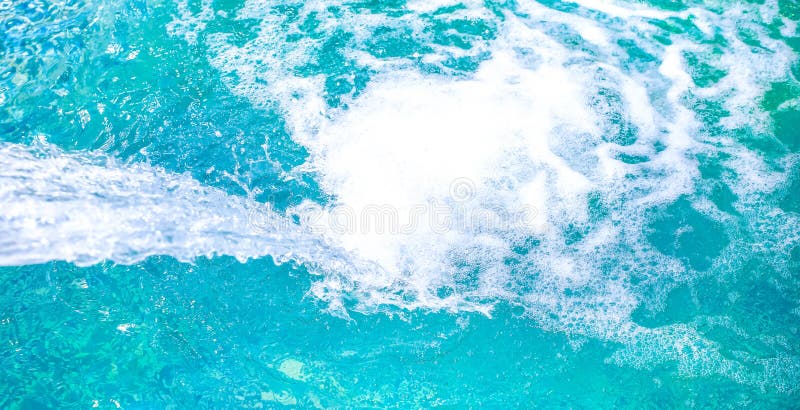 Water stream in the blue pool at the fitness centre. Relaxing hobby after a hard day. Healthy living lifestyle concept royalty free stock photos