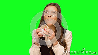 Girl eating hamburger Hiding that it could not be seen. Girl eating hamburger Green screen keying in a single click, correct skin stock video