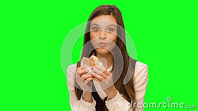 Girl eating hamburger Hiding that it could not be seen Have fun very strong. Girl eating hamburger Green screen keying in a single click, correct skin stock video footage