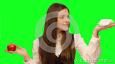 Woman choosing to eat burger instead of apple. Green screen keying in a single click, correct skin stock video