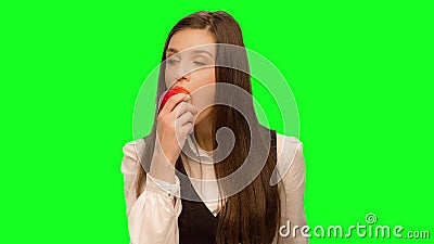 Woman choosing to eat burger instead of apple Selects apple and eat it. Woman choosing to eat burger instead of apple Green screen keying in a single click stock footage