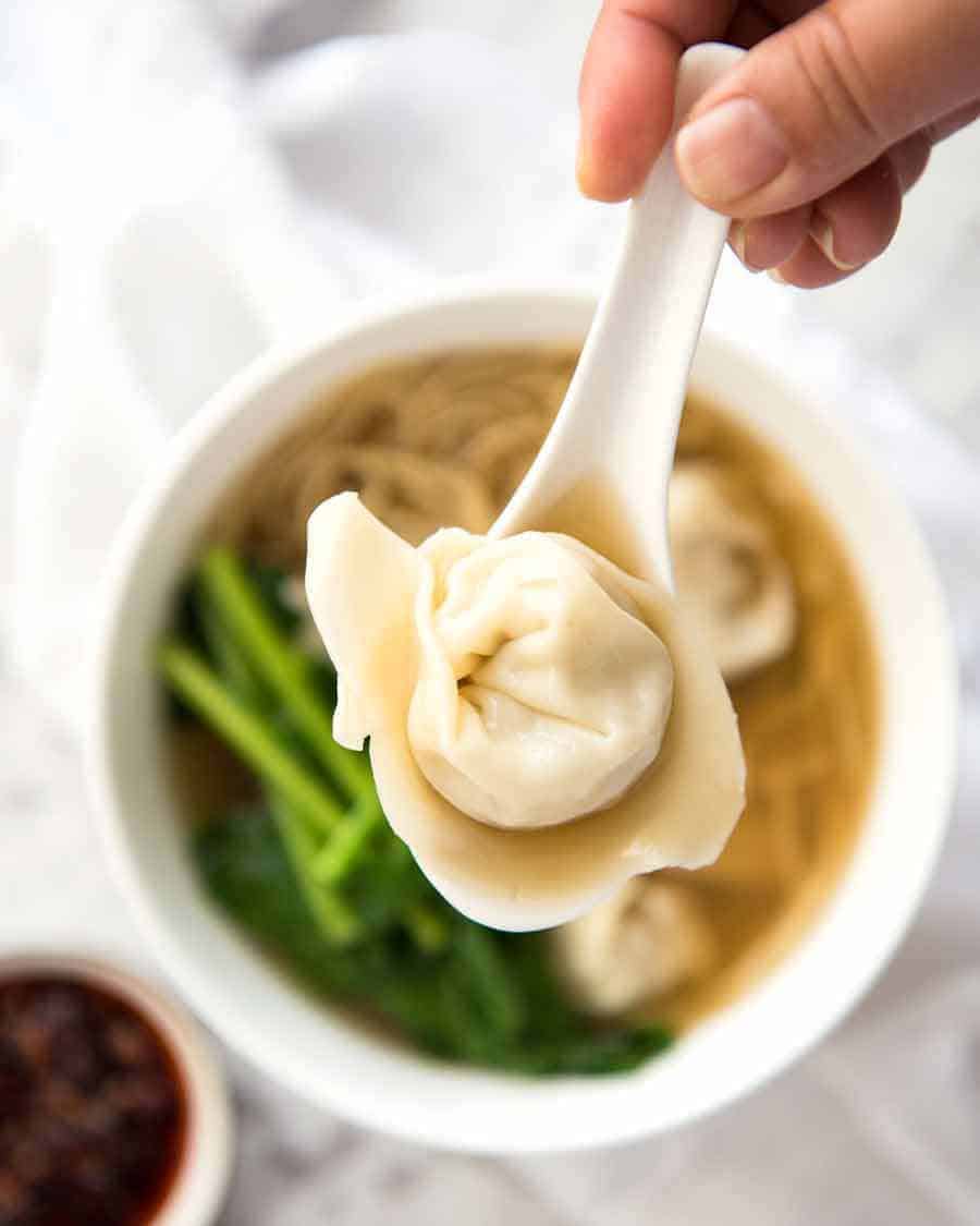 Close up of spoon with a wonton